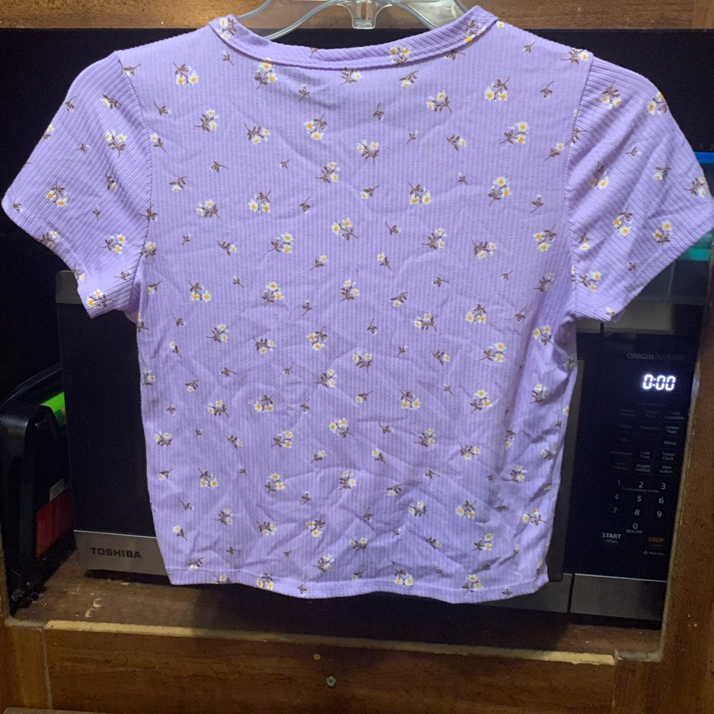 Purple crop top with cute flowers.
